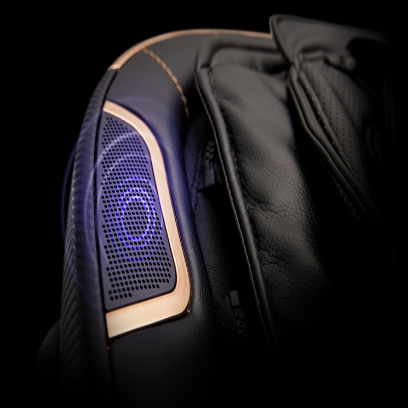 Close-up of a massage chair with a glowing blue light on a black background